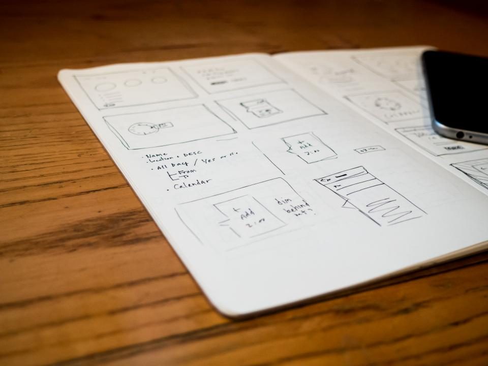 A designer sketching at a desk